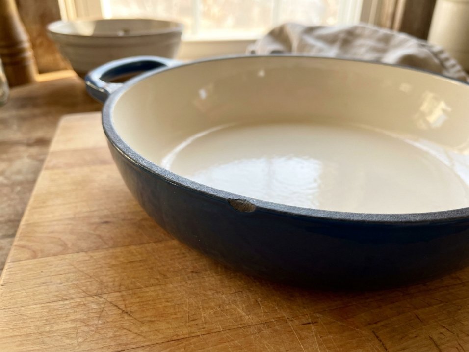 Enameled dutch oven interior with light cream-colored enamel surface